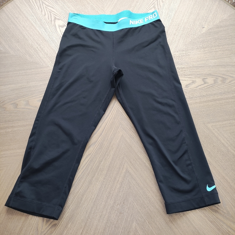 Nike Black Leggings with Teal Waistband.  Size L
